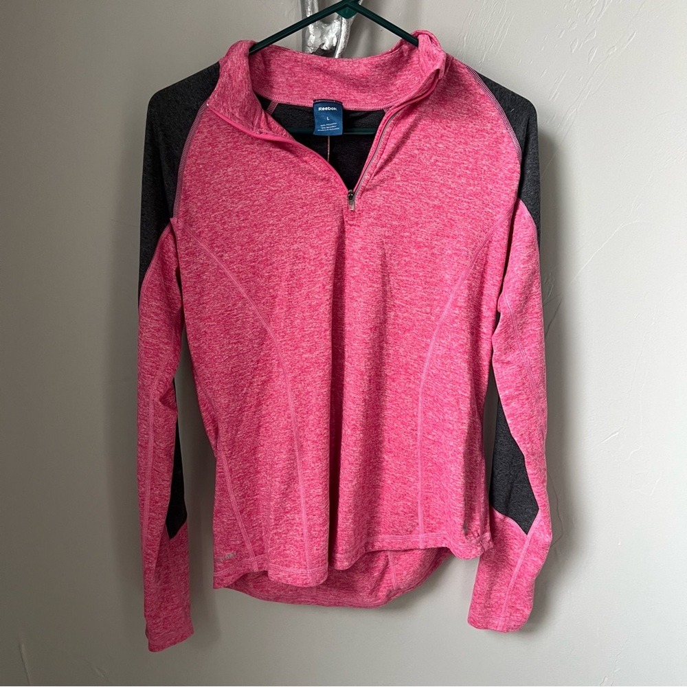 Reebok pink and black quarter zip size large in good condition